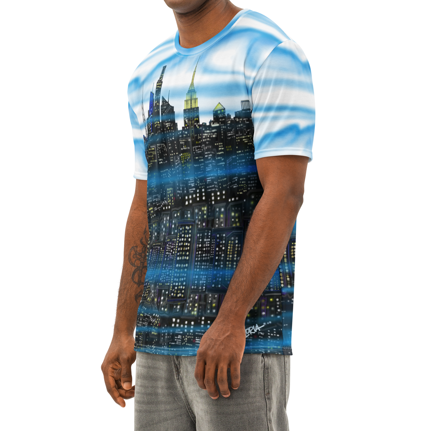 Man wearing a Loria NYC Art t-shirt with a cityscape design on a white background