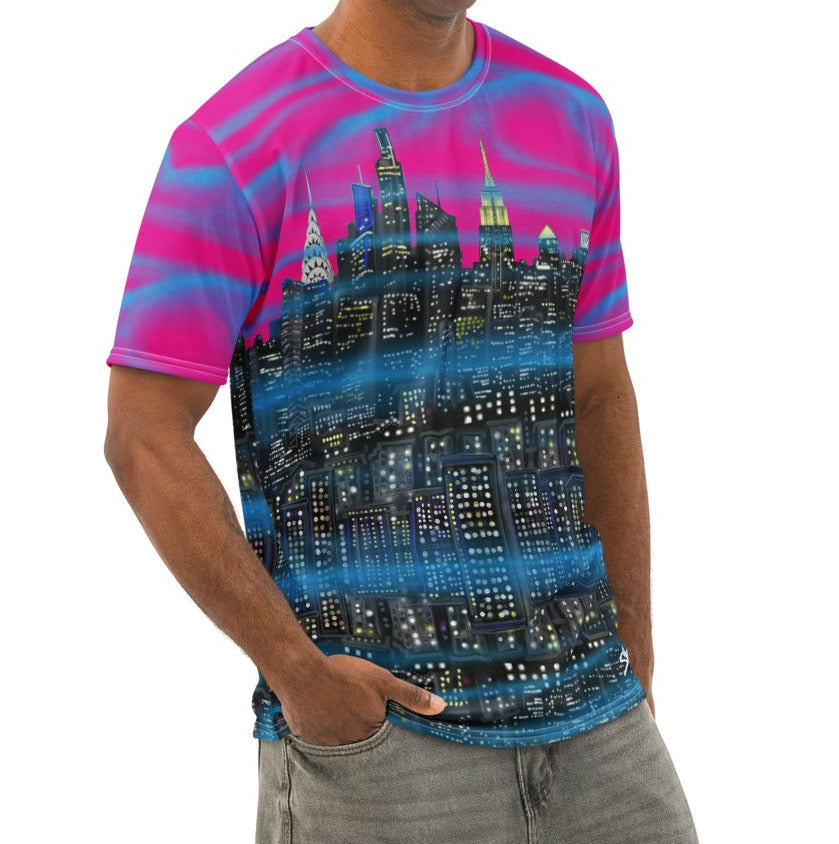 Man wearing a colorful Loria NYC Art t-shirt with a cityscape design on a white background