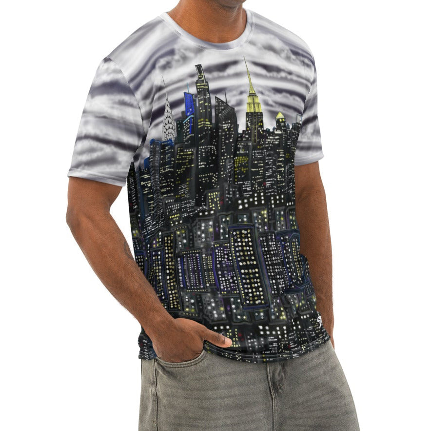 Man wearing a Loria NYC Art shirt and jeans on a white background