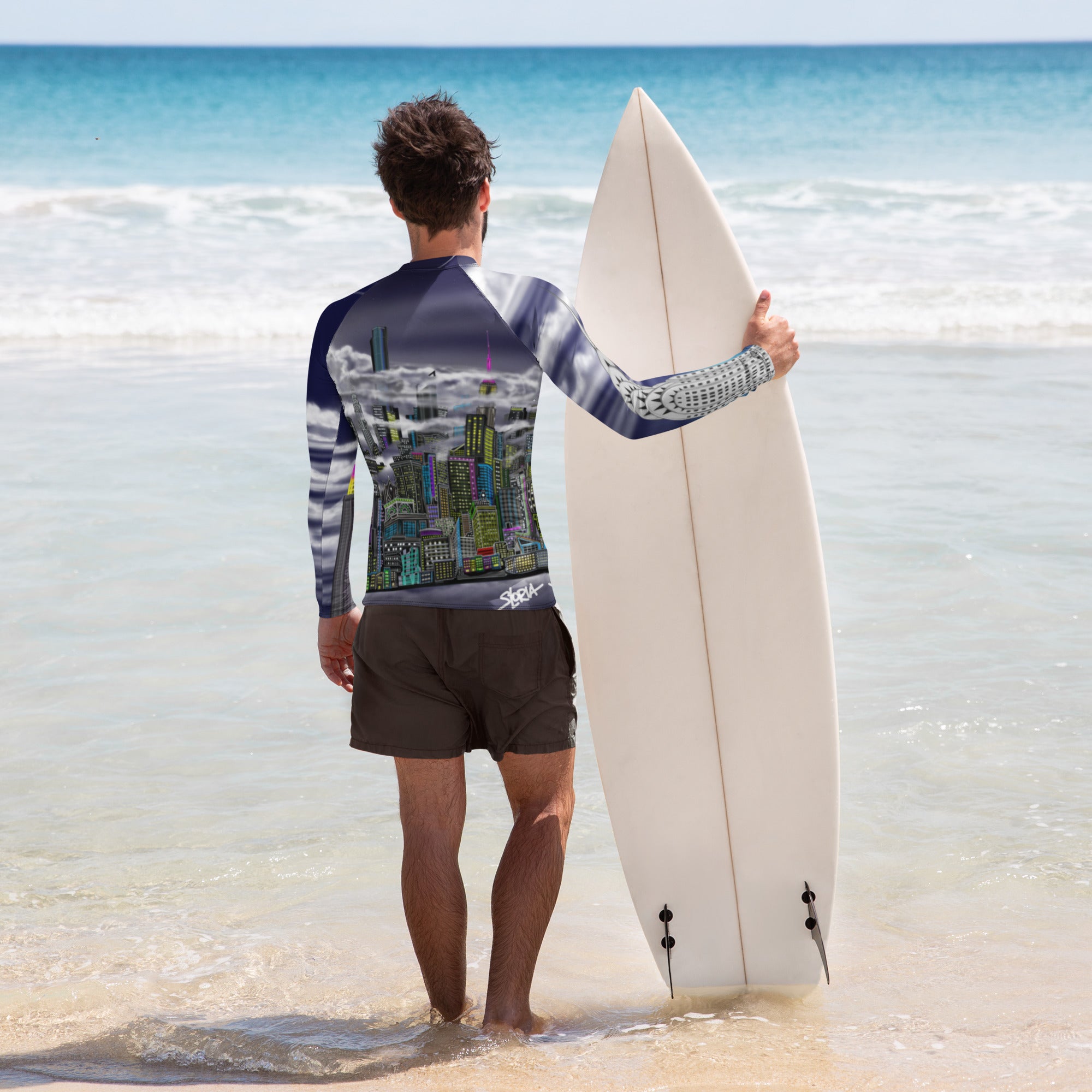 Man on beach with surf board wearing athletic Rash Guard with Cavaliere dell'Impero artistic NYC skyline design by S.Loria NYC Art