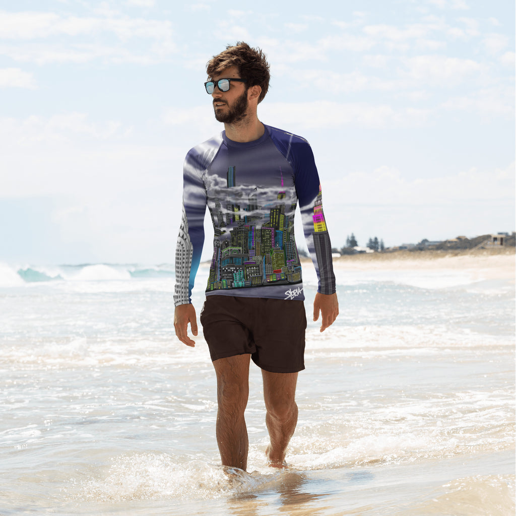 Man on beach wearing a Loria NYC Art athletic shirt on the beach