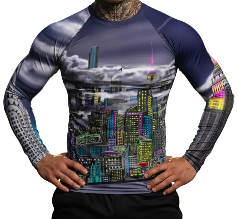 Man wearing a Loria NYC Art rash guard shirt on a white background.