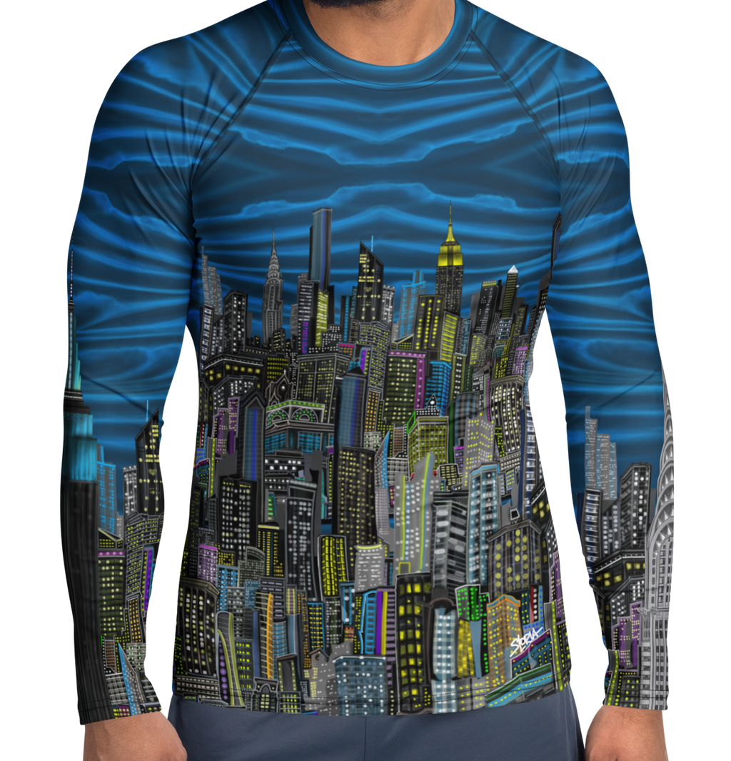 Man wearing a blue and black patterned long-sleeve Loria NYC Art shirt on a white background
