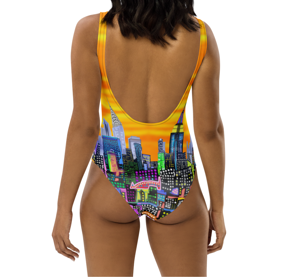 Back of a Woman wearing a colorful Loria NYC Art cityscape swimsuit on a white background