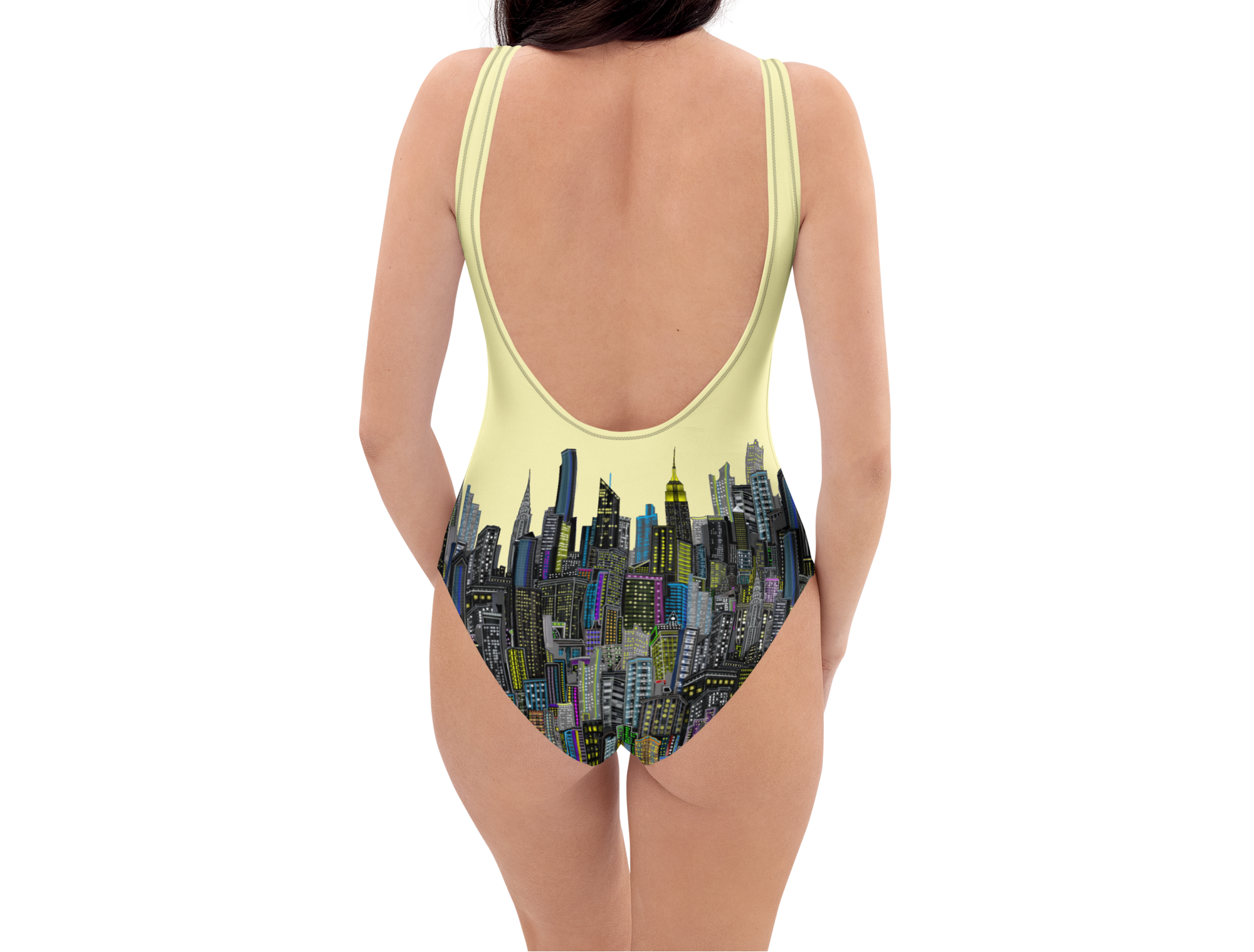 One-piece yellow swimsuit with Loria NYC Art cityscape design on a white background