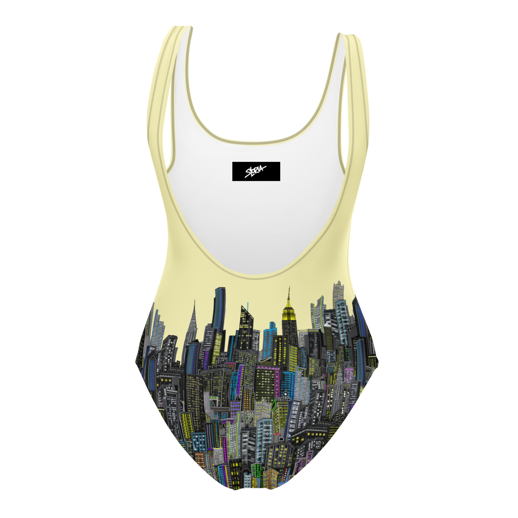 Back of a Swimsuit with cityscape Loria NYC Art design and yellow straps on a white background