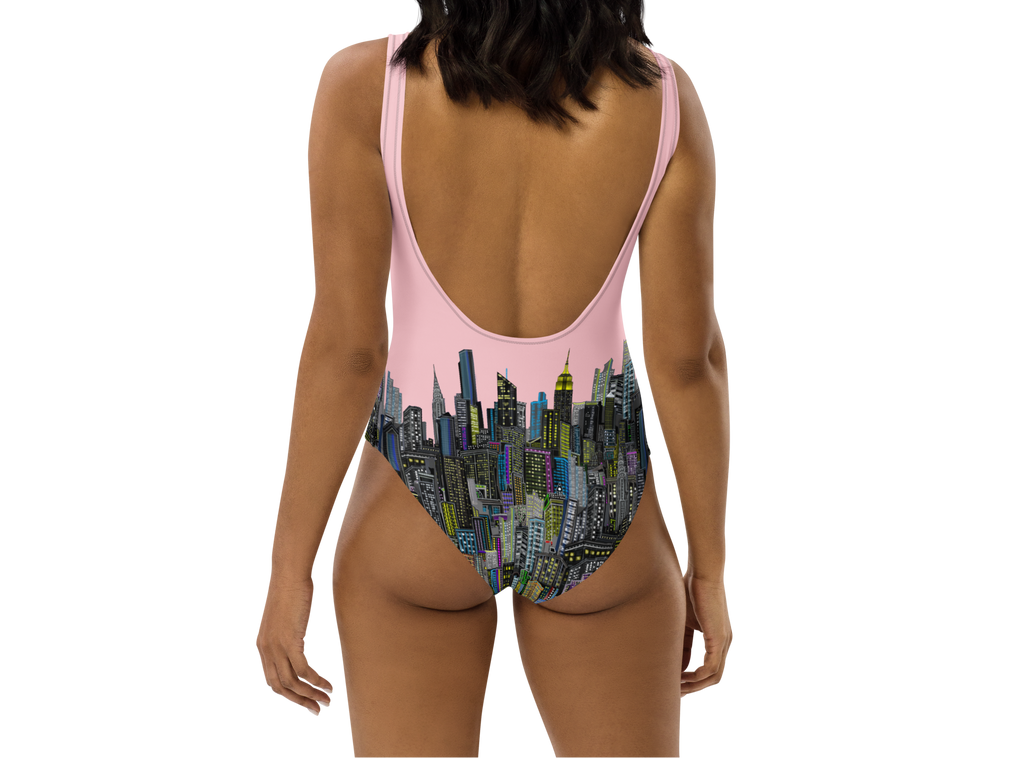 Rear view of a One-piece swimsuit with Loria NYC Art cityscape design on a white background