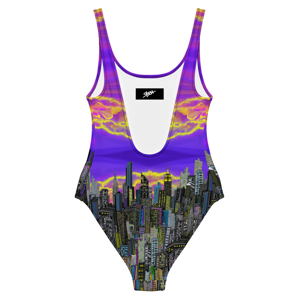 One-piece swimsuit with Loria NYC Art cityscape design and purple gradient on a white background