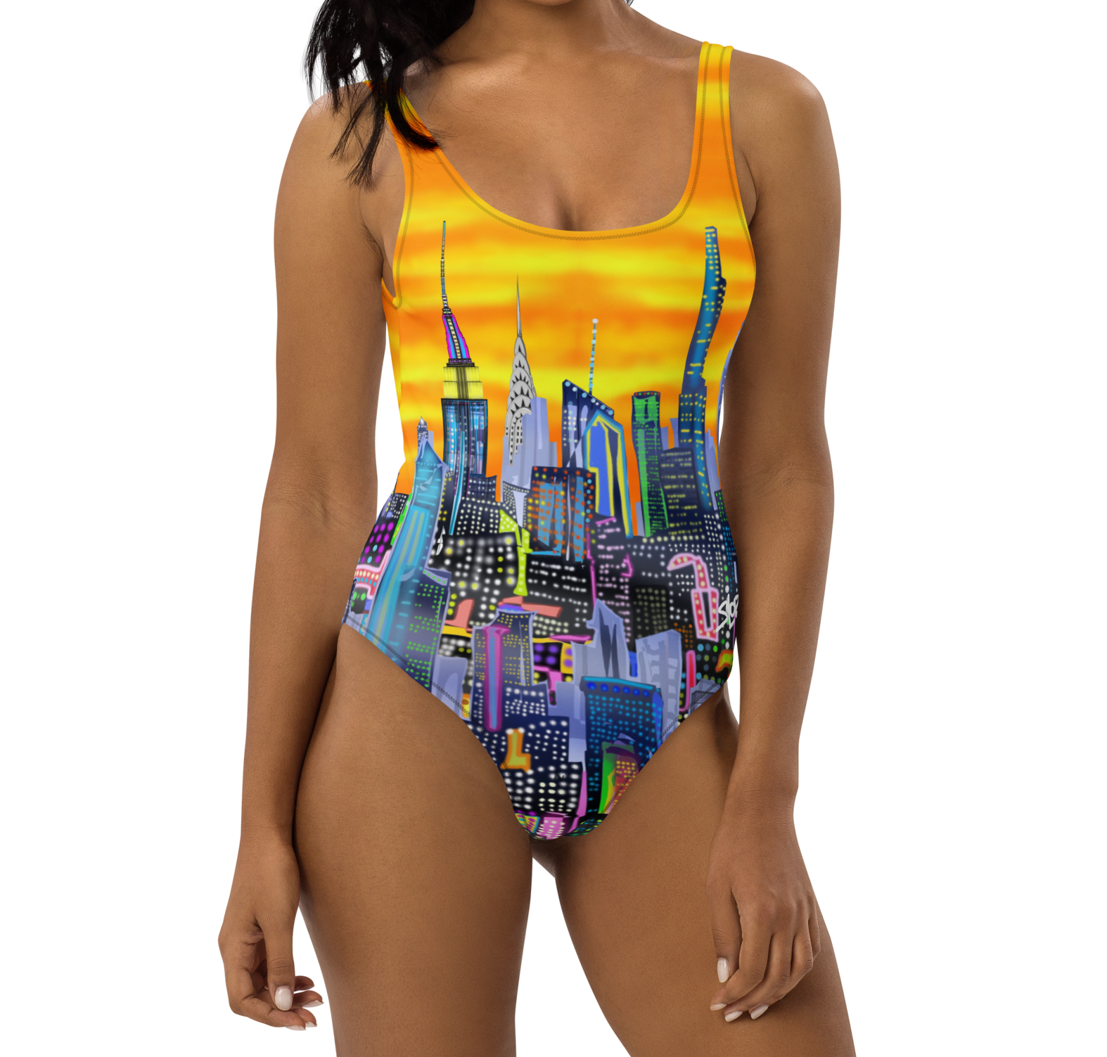 Woman wearing a colorful Loria NYC Art cityscape swimsuit on a white background