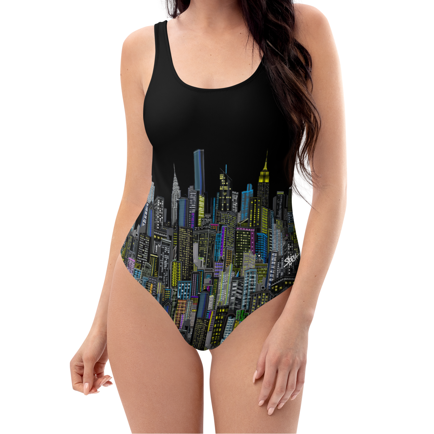 Woman wearing a black one-piece swimsuit with Loria NYC Art cityscape design on a white background