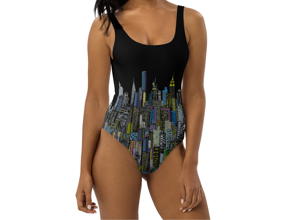 Woman wearing a black one-piece swimsuit with cityscape Loria NYC Art design on a white background