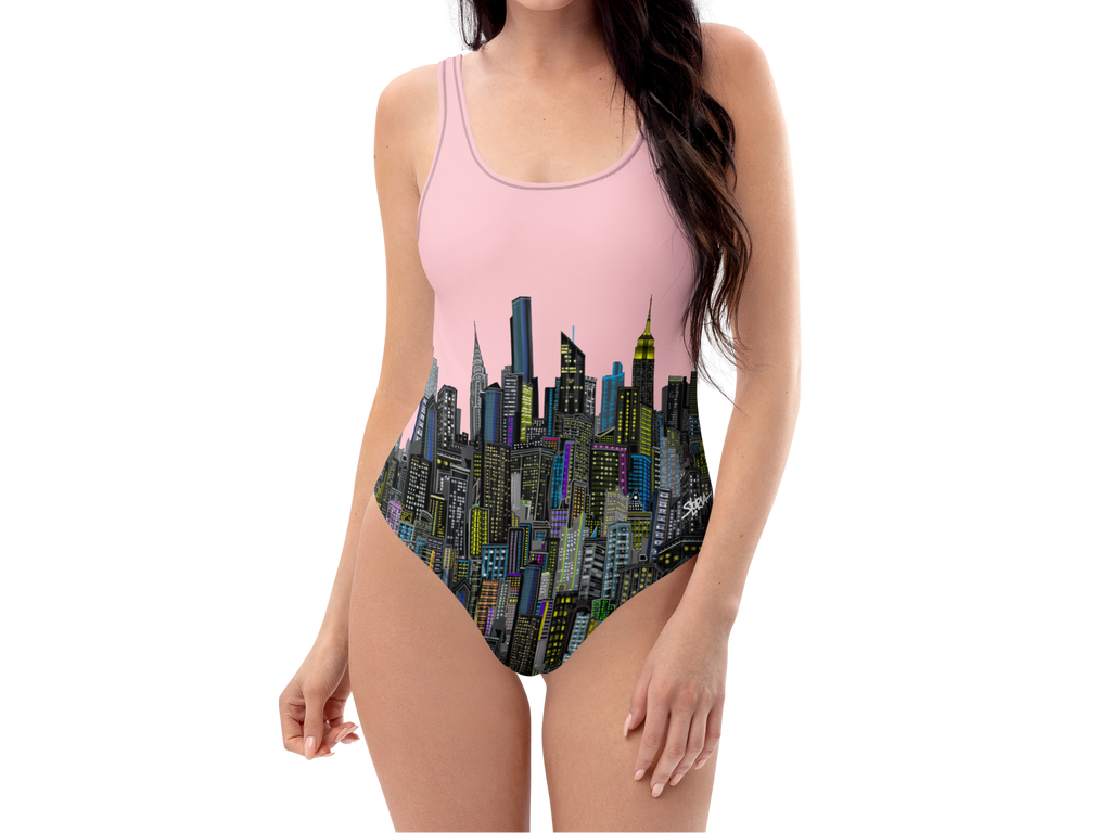 Front of a Woman wearing a one-piece swimsuit with city Loria NYC Art skyline design on a white background