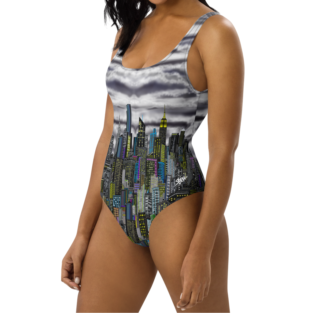 Woman wearing a one-piece swimsuit with cityscape Loria NYC Art design on a white background