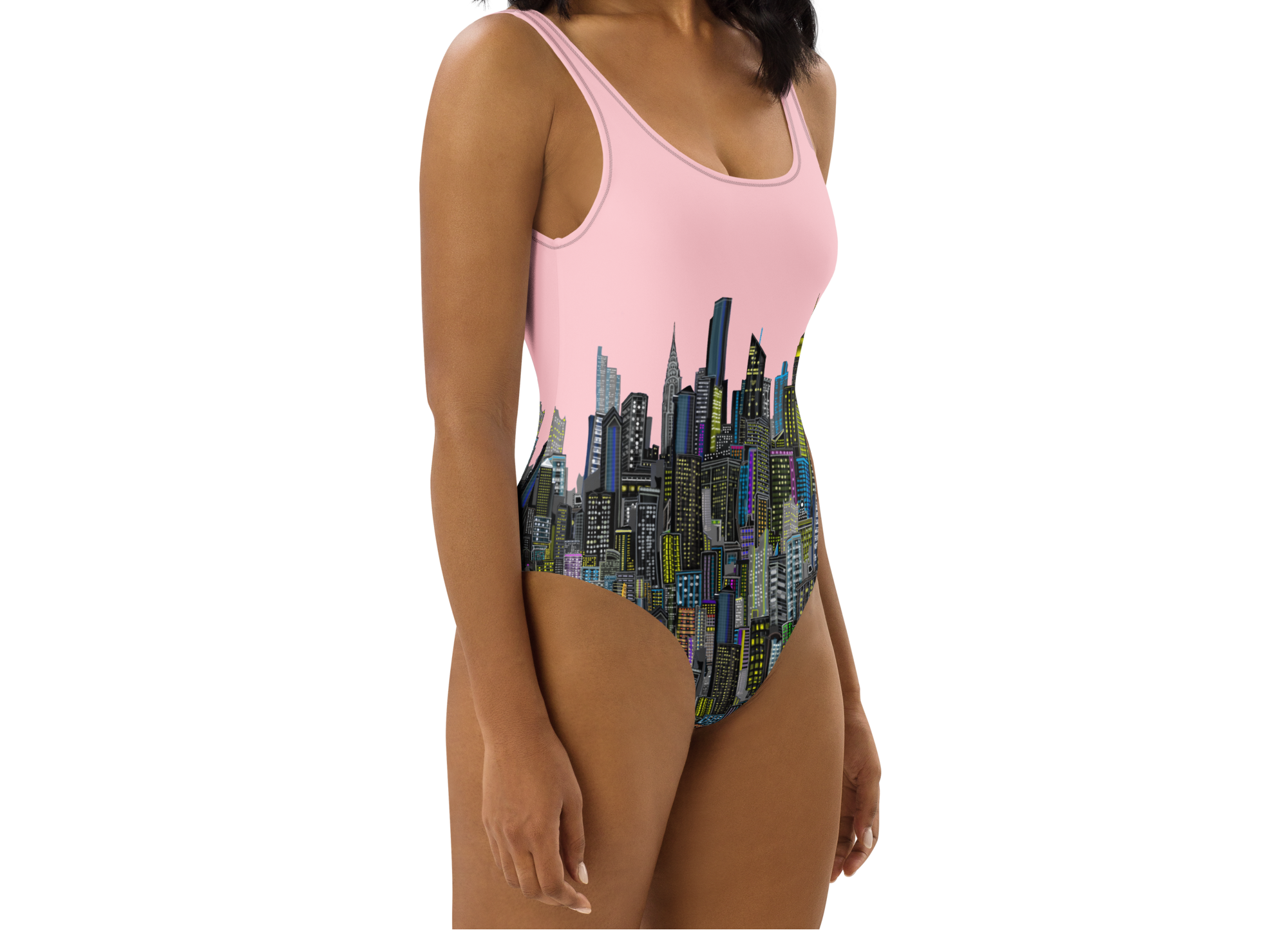 Woman wearing a pink and multicolor cityscape Loria NYC Art one-piece swimsuit on a white background
