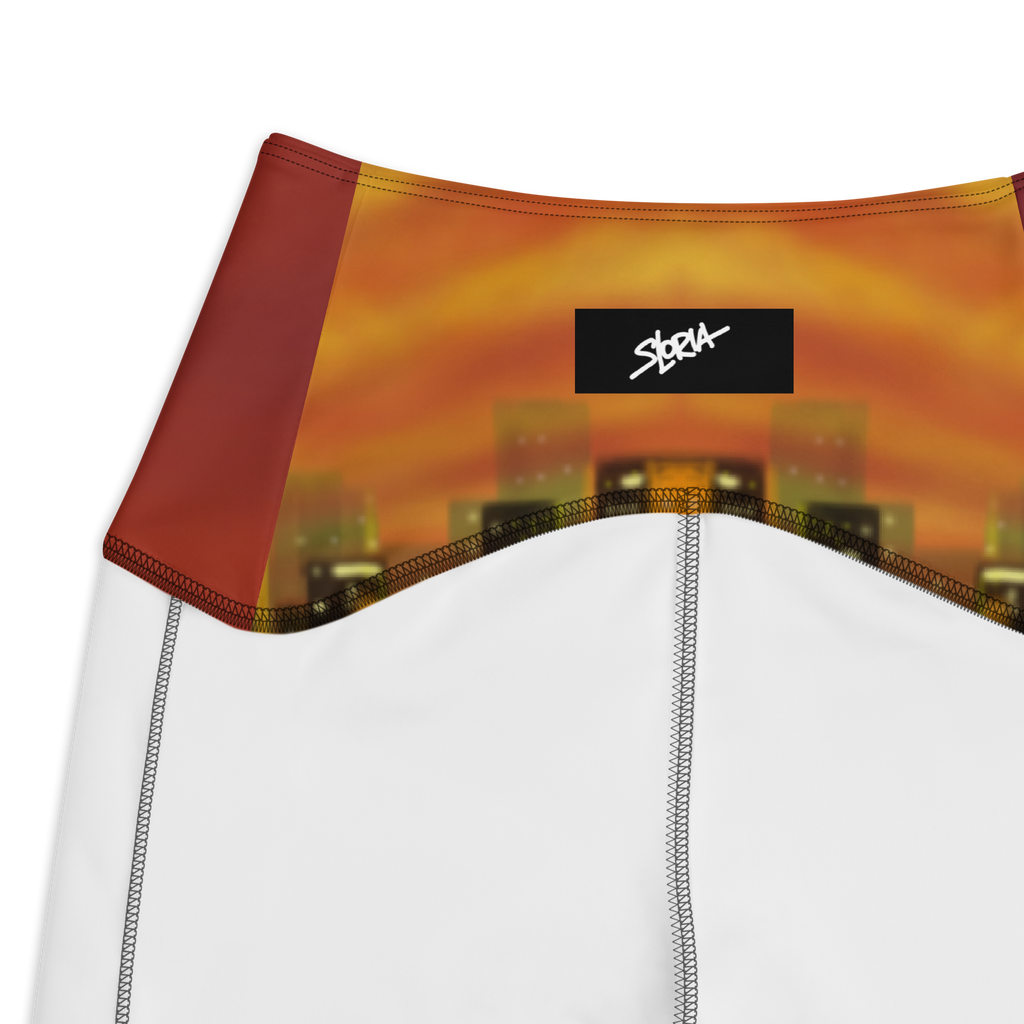 Close-up of a Loria NYC Art garment with a sunset design and SLoria logo.