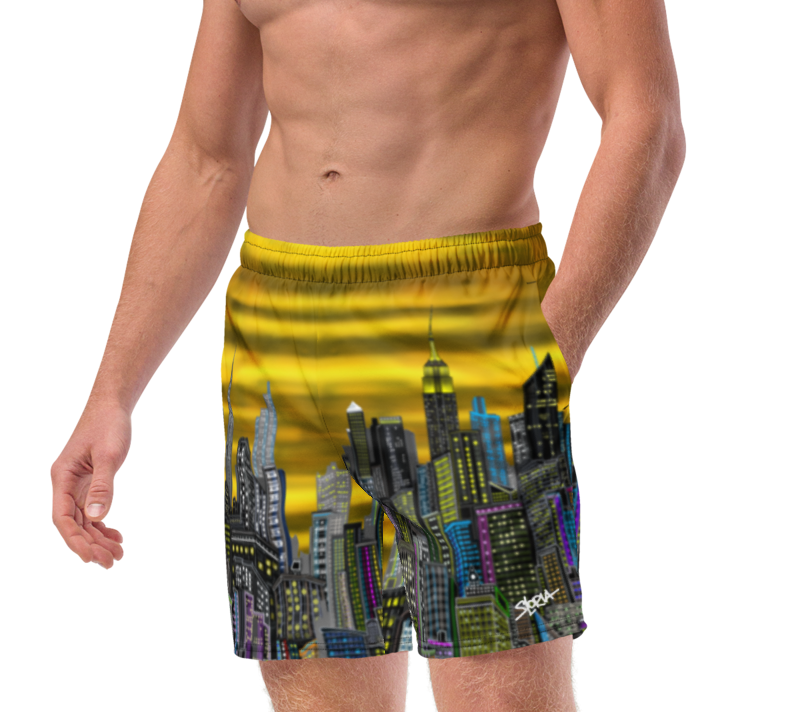 Man wearing a Loria NYC Art colorful swimsuit with a cityscape design on a white background