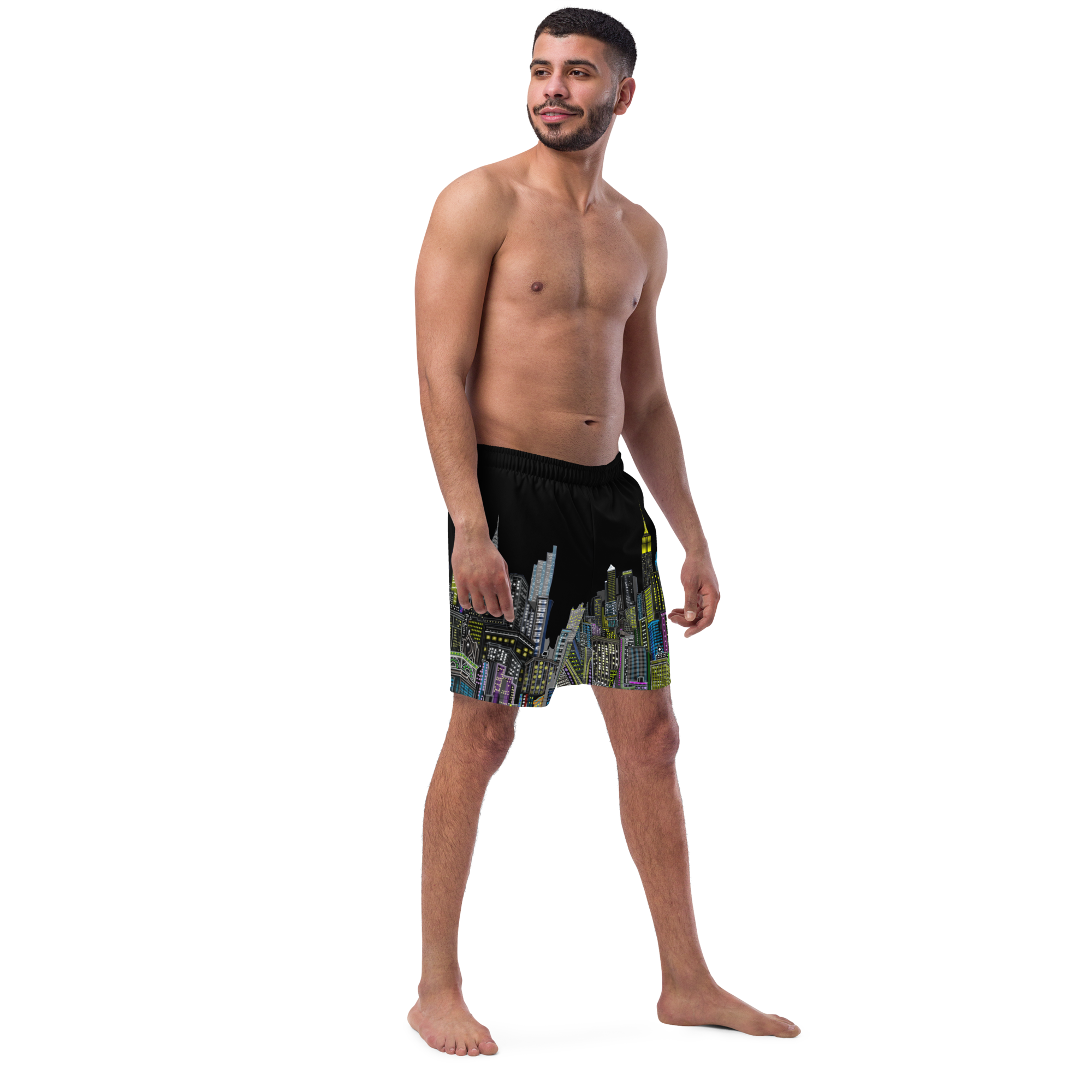 Man wearing a colorful Loria NYC Art swim shorts on a white background