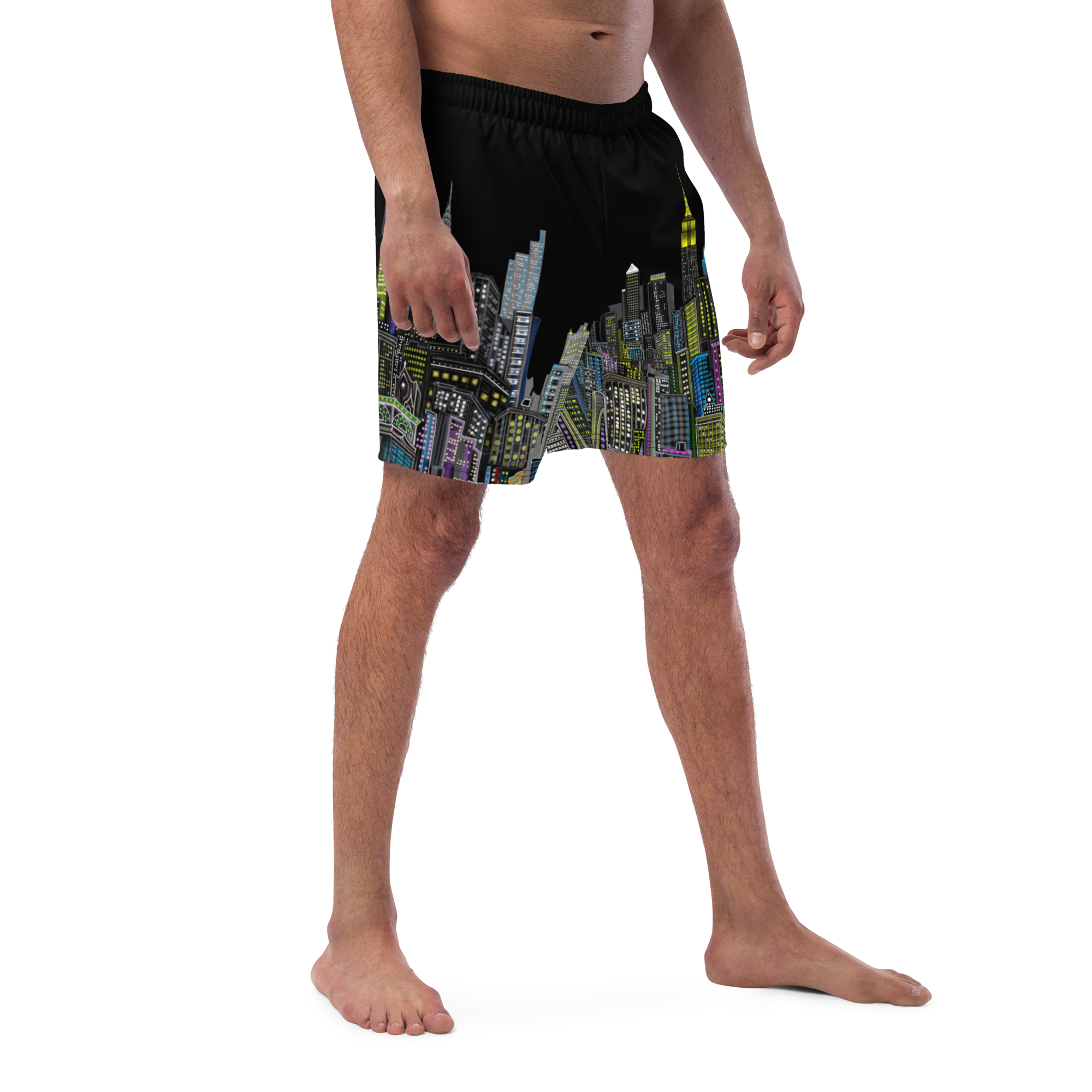 Person wearing a colorful Loria NYC Art swim shorts on a white background