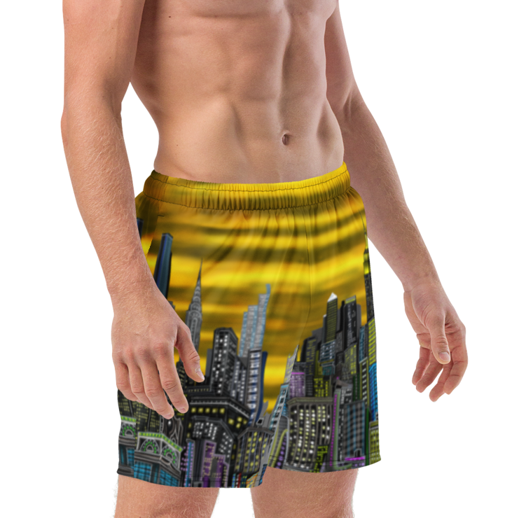 Man wearing a colorful swim shorts with a cityscape Loria NYC Art design on a white background