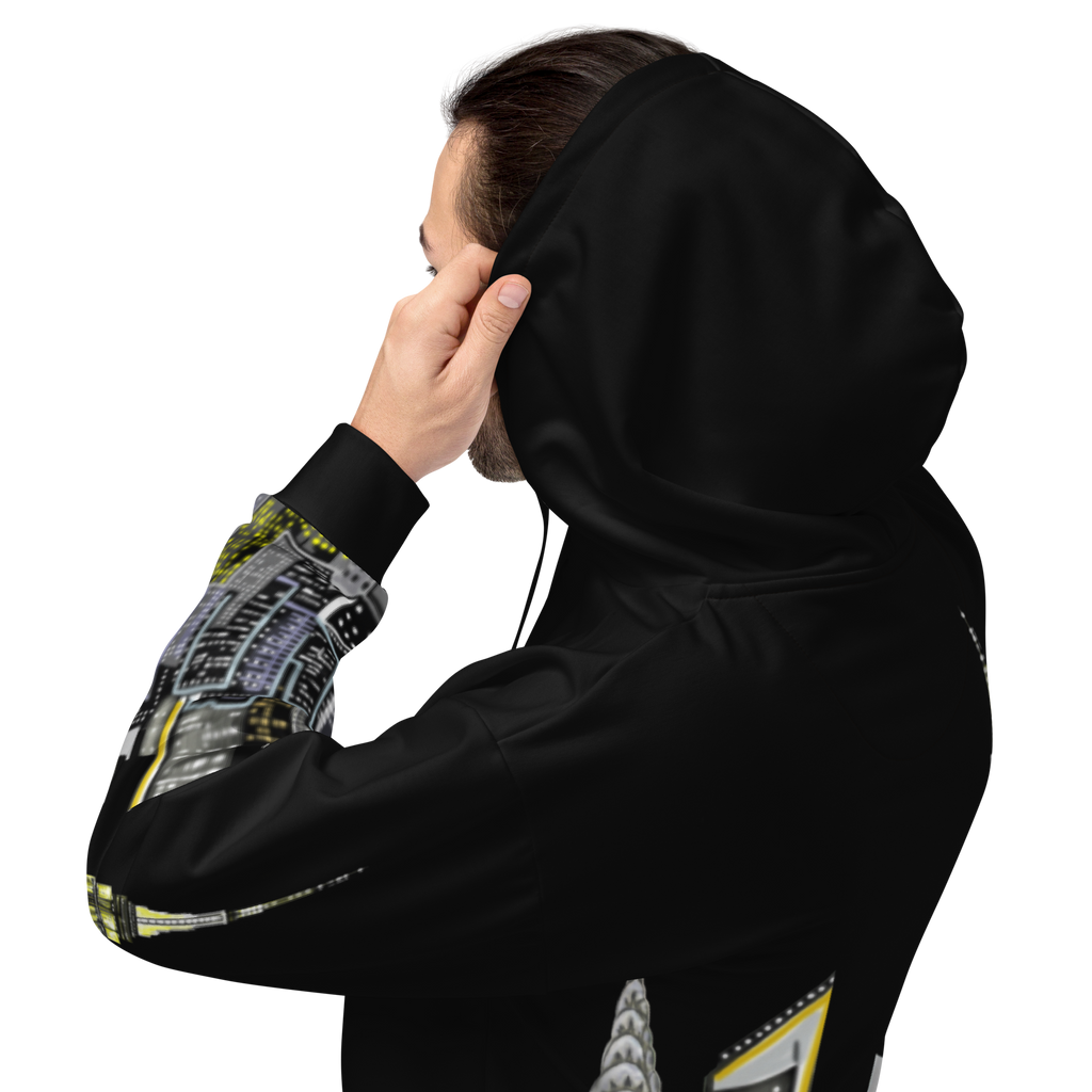 Person wearing a black Loria NYC Art hoodie with geometric patterned sleeves on a white background