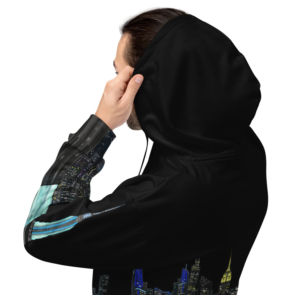 Person wearing a black Loria NYC Art hoodie with a cityscape design on the sleeve, on a white background