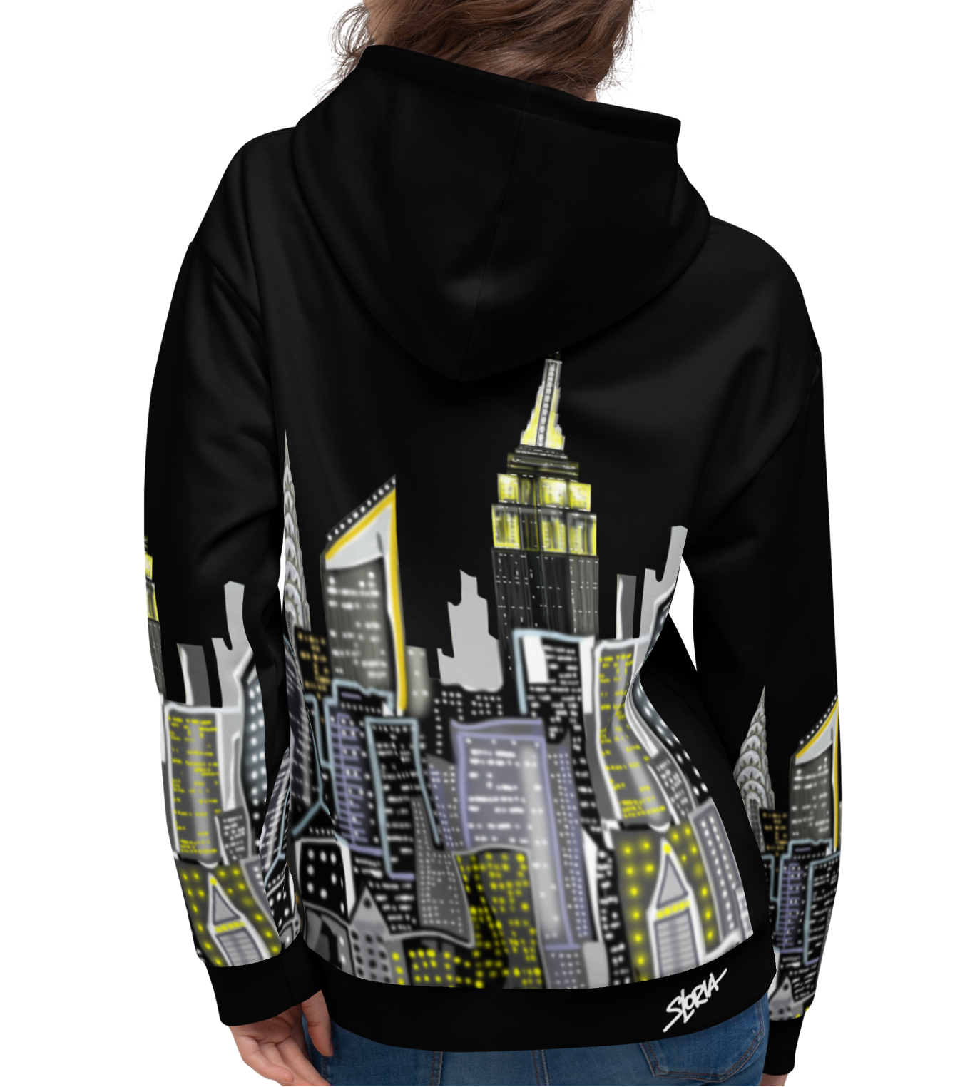 Rear view of women wearing a black Loria NYC Art hoodie with a cityscape design on the back, on a white background