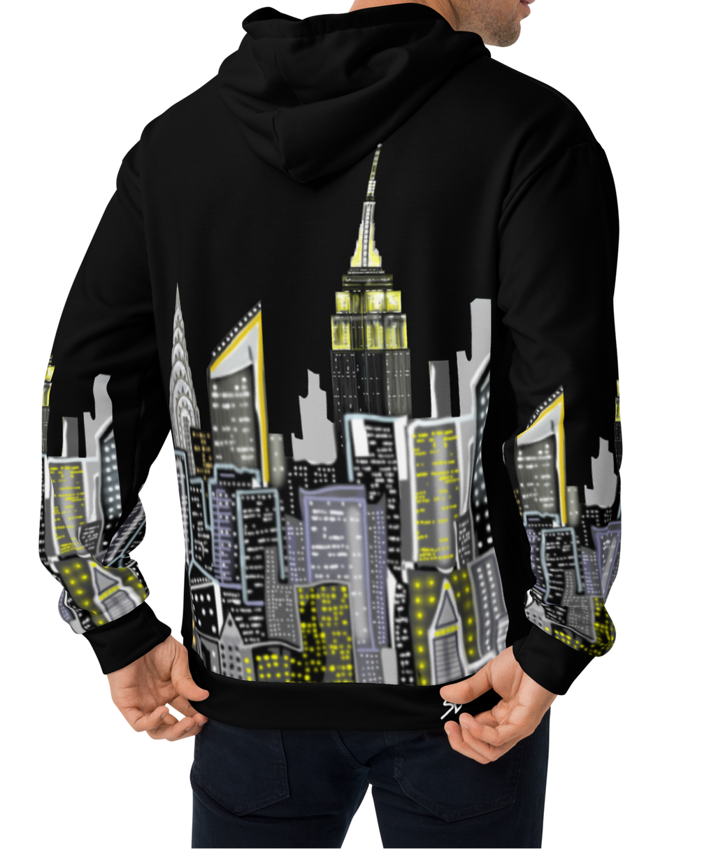 Person wearing a black hoodie with a cityscape Loria NYC Art design on the back, standing against a white background.