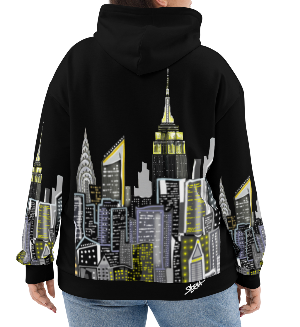 Person wearing a black hoodie with a cityscape Loria NYC Art design on the back, standing against a white background.