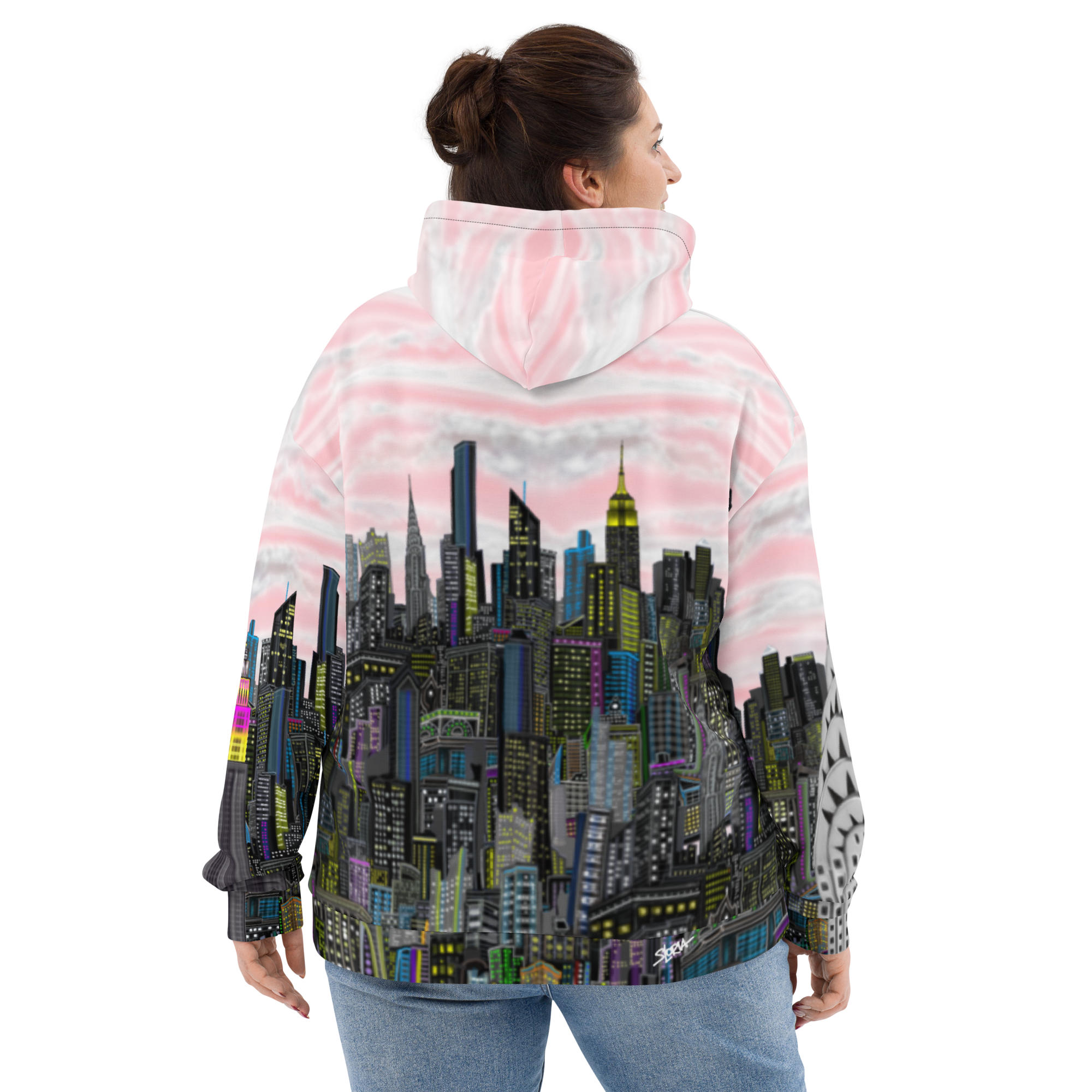 Person wearing a jacket with a cityscape Loria NYC Art  design on the back, standing against a white background