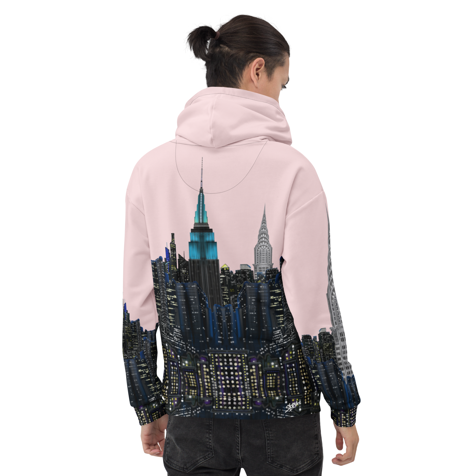 Person wearing a pink hoodie with a cityscape Loria NYC Art design on the back, standing against a white background.