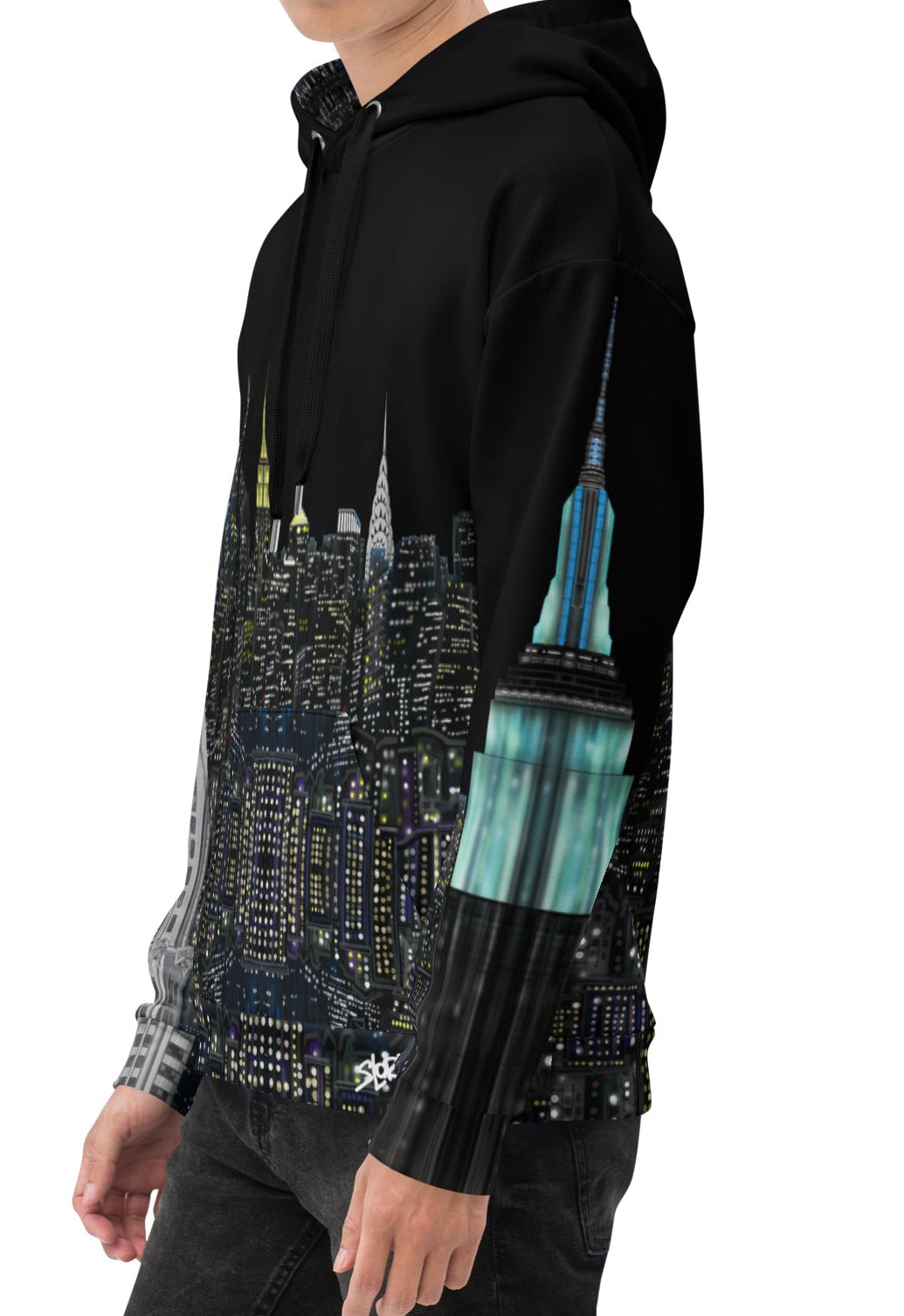 Person wearing a black hoodie with Loria NYC Art cityscape design on a white background