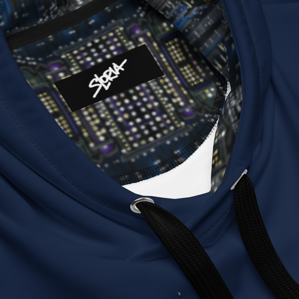 Close-up of a blue  Loria NYC Art hoodie with a brand logo on the chest pocket against a blurred electronic circuit board background.