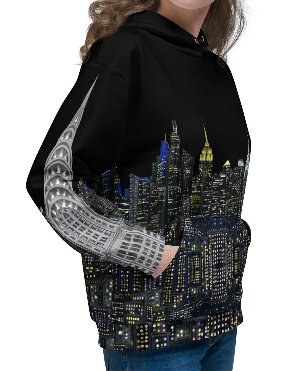 Woman wearing a Loria NYC Art black hoodie with a cityscape design on a white background