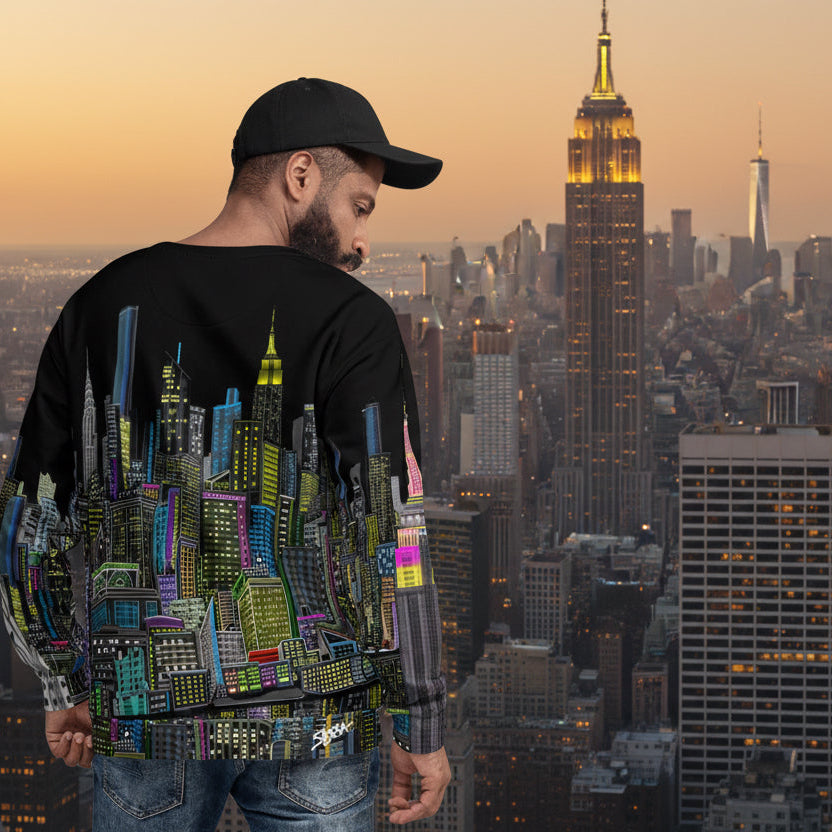 Guy showing rear view of a black sweatshirt with a colorful cityscape design by Loria NYC Art on a skyline background