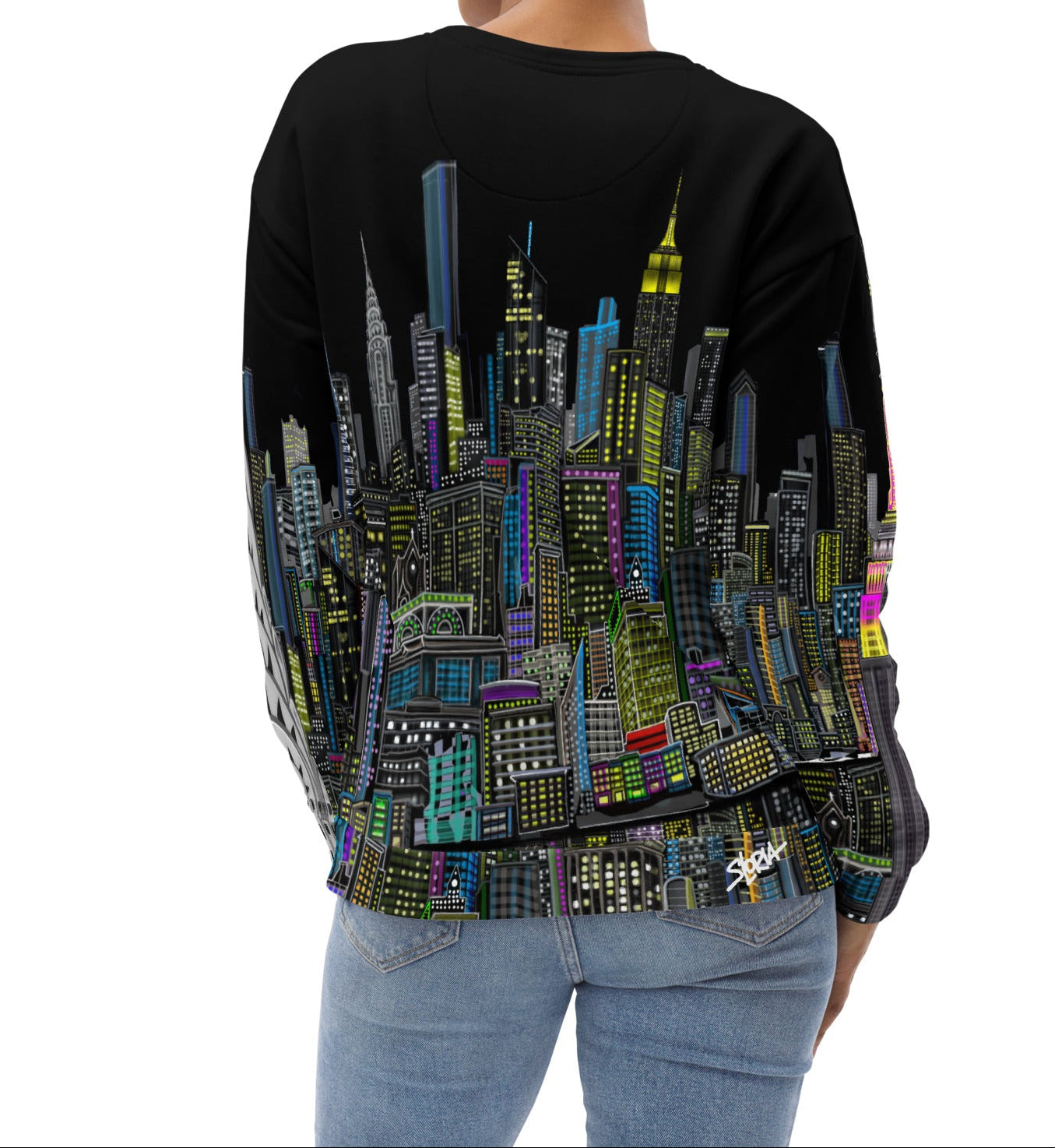 Backside of Girl wearing a black sweatshirt with a colorful cityscape design by Loria NYC Art on a white background