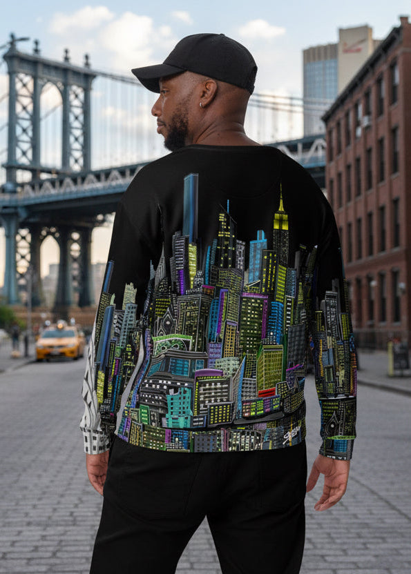 Guy posing rear view of a black sweatshirt with a colorful cityscape design by Loria NYC Art on a urban  background
