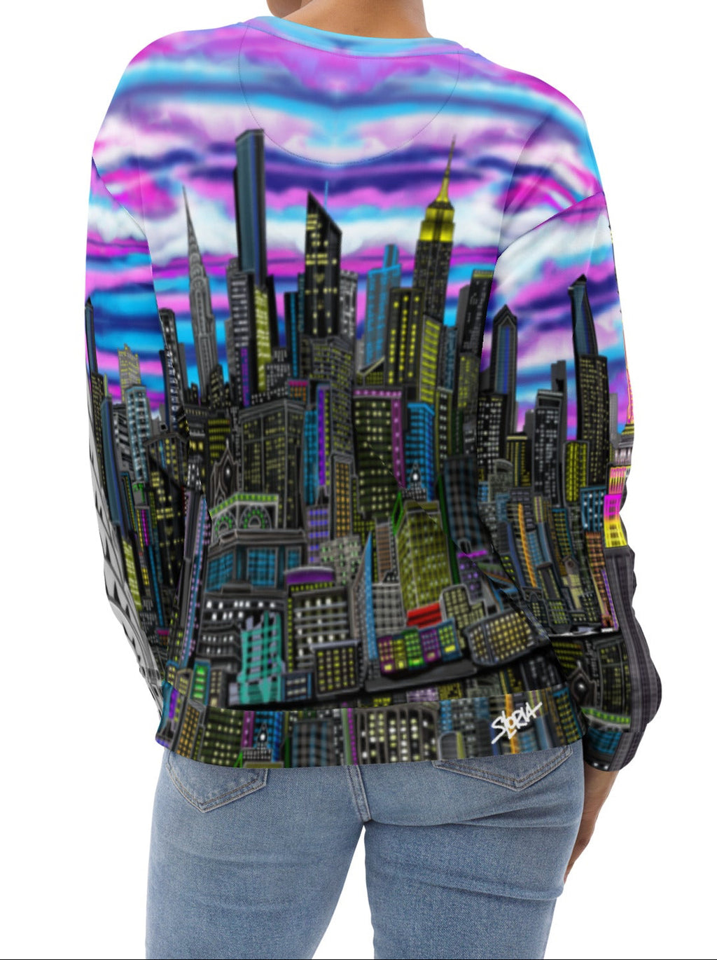 Back of Women wearing a colorful sweat shirt design by Loria NYC Art with a cityscape design on a white background
