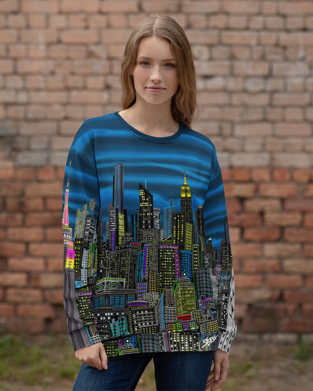 Person wearing Back of Colorful cityscape sweatshirt designed by Loria NYC Art on a brick wall background
