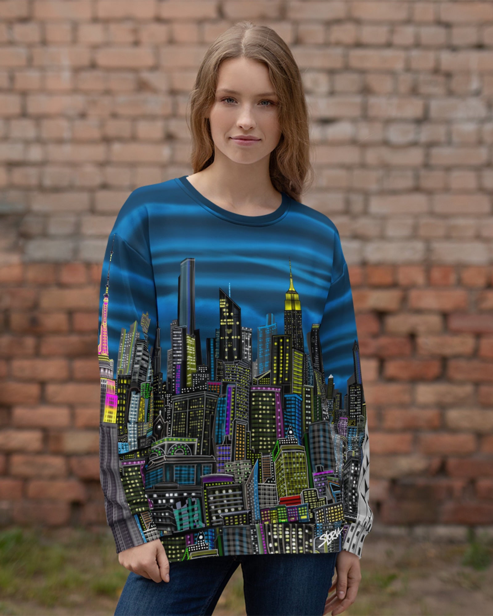 Person wearing Back of Colorful cityscape sweatshirt designed by Loria NYC Art on a brick wall background