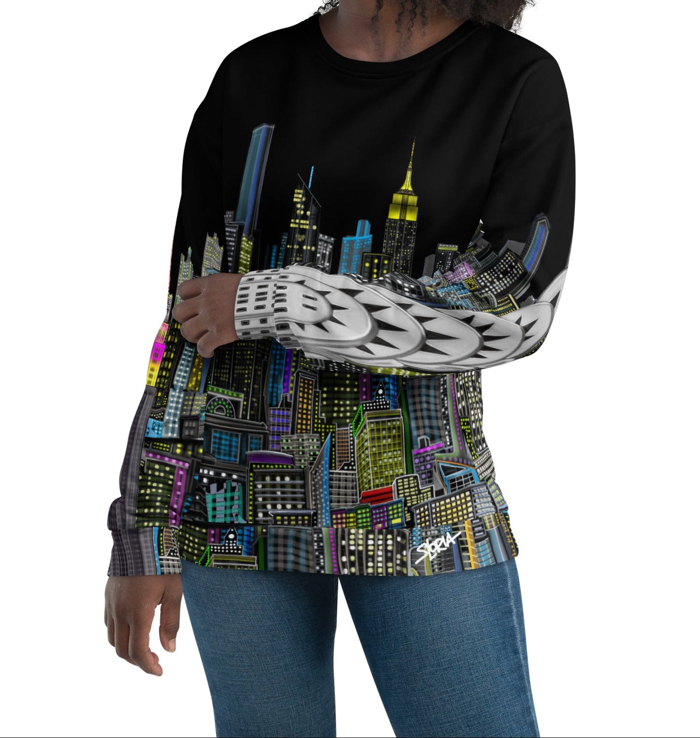Girl wearing a black sweatshirt with a colorful cityscape and Chrysler building on arm, design by Loria NYC Art on a white background