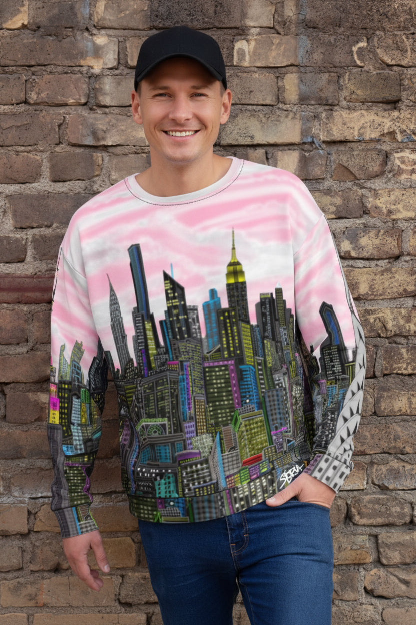 Guy wearing pink Loria NYC Art sweatshirt in front of a brick wall