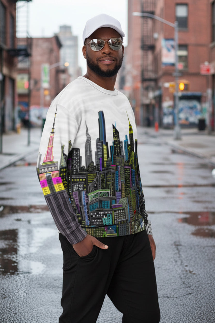 Man wearing a sweater with a Loria NYC Art colorful cityscape design on a white background