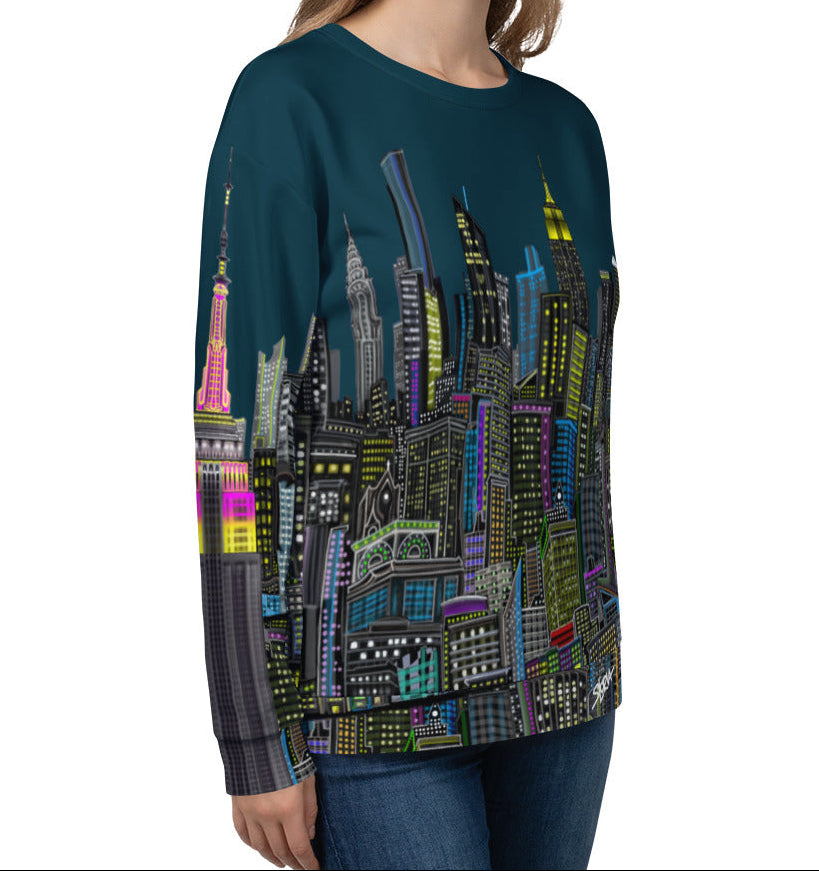 Side view of girl wearing a long-sleeve shirt with a cityscape design by Loria NYC Art on a white background