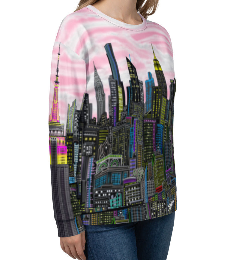 Person wearing a sweatshirt with a colorful cityscape design by Loria NYC Art on a white background