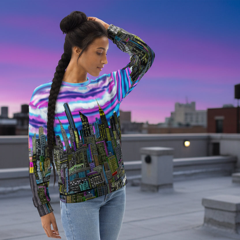 Women posing by wearing a colorful sweat shirt design by Loria NYC Art with a cityscape design on a white background