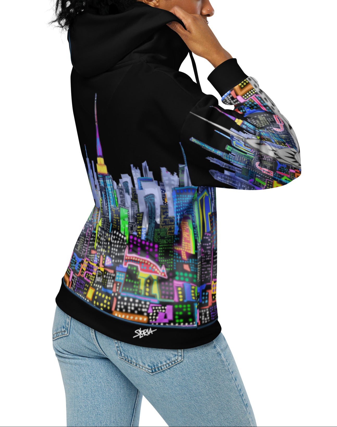 Girl holding holding Black hoodie with colorful cityscape design by Loria NYC Art on a white background