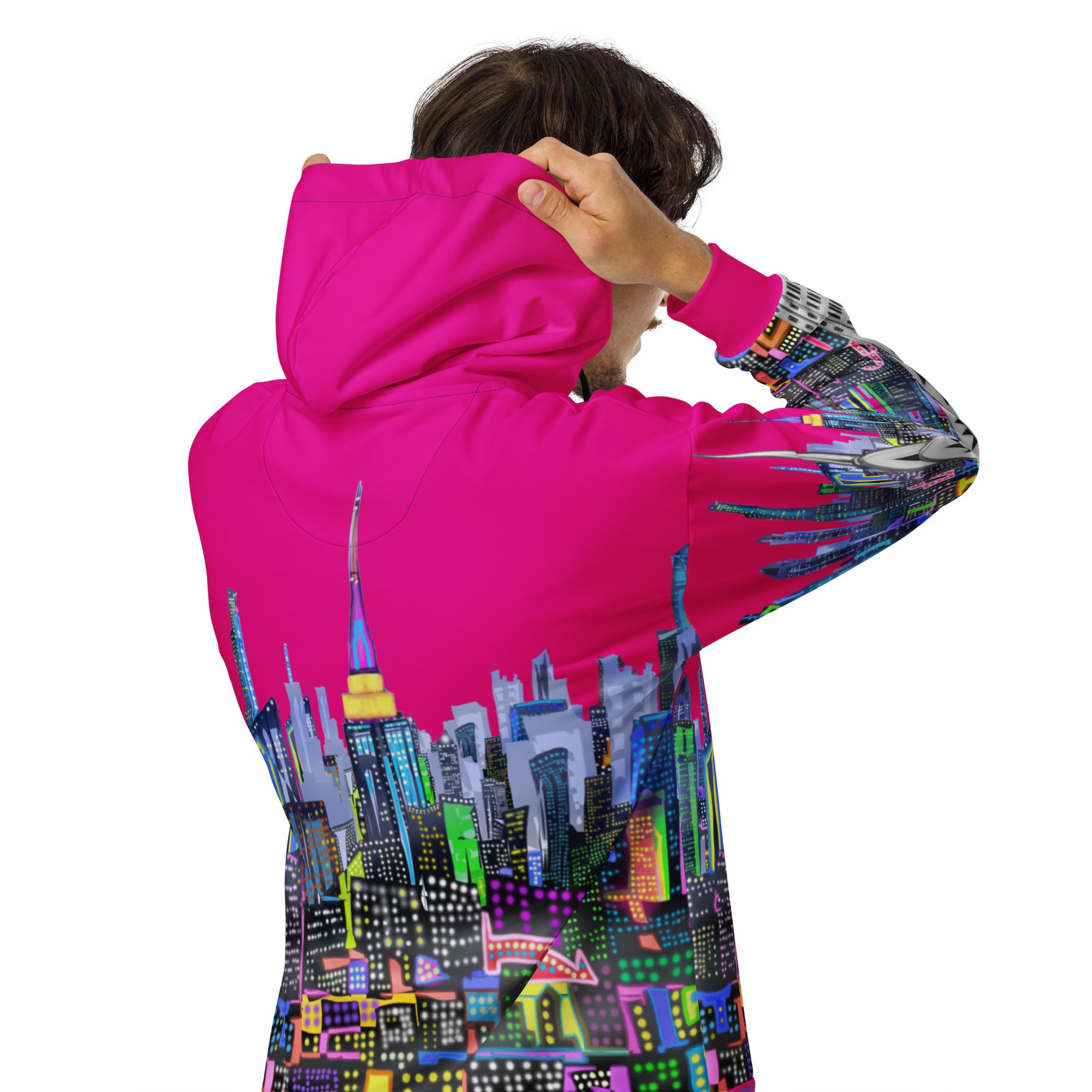Person wearing a pink fuchsia Loria NYC Art hoodie with a colorful cityscape design on the back, on a white background.