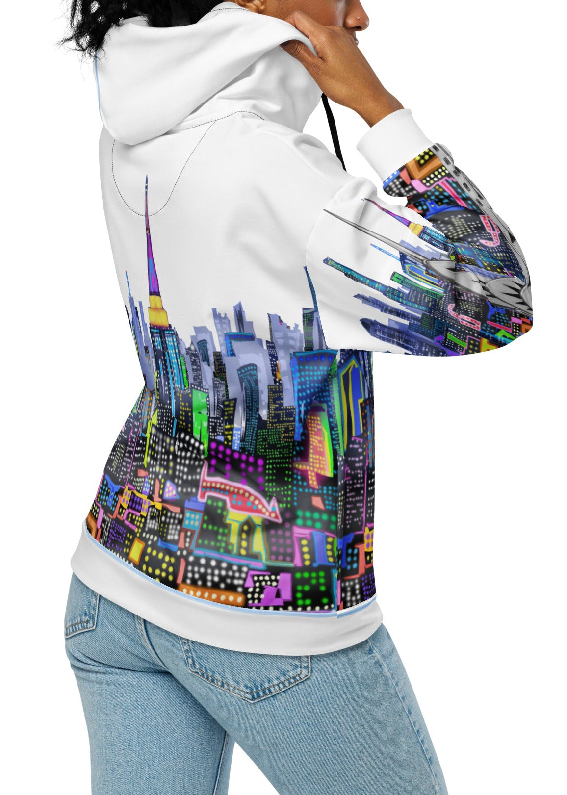 Side of Person wearing a hoodie with a colorful Loria NYC Art cityscape design on a white background