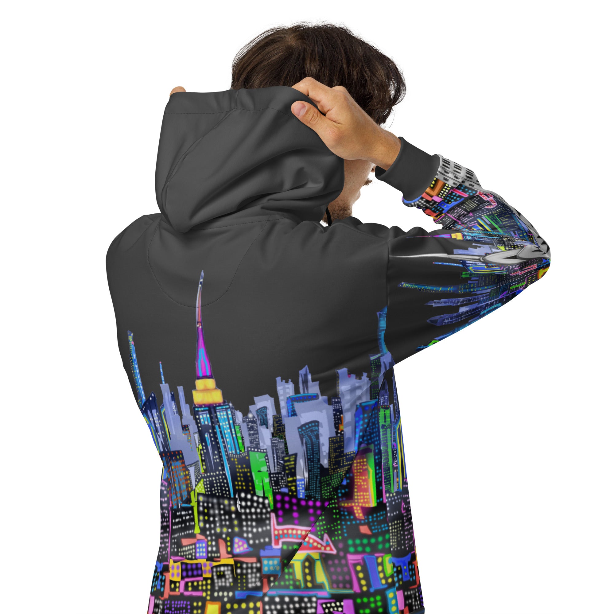 Person wearing a hoodie with a Loria NYC Art colorful cityscape design on the back