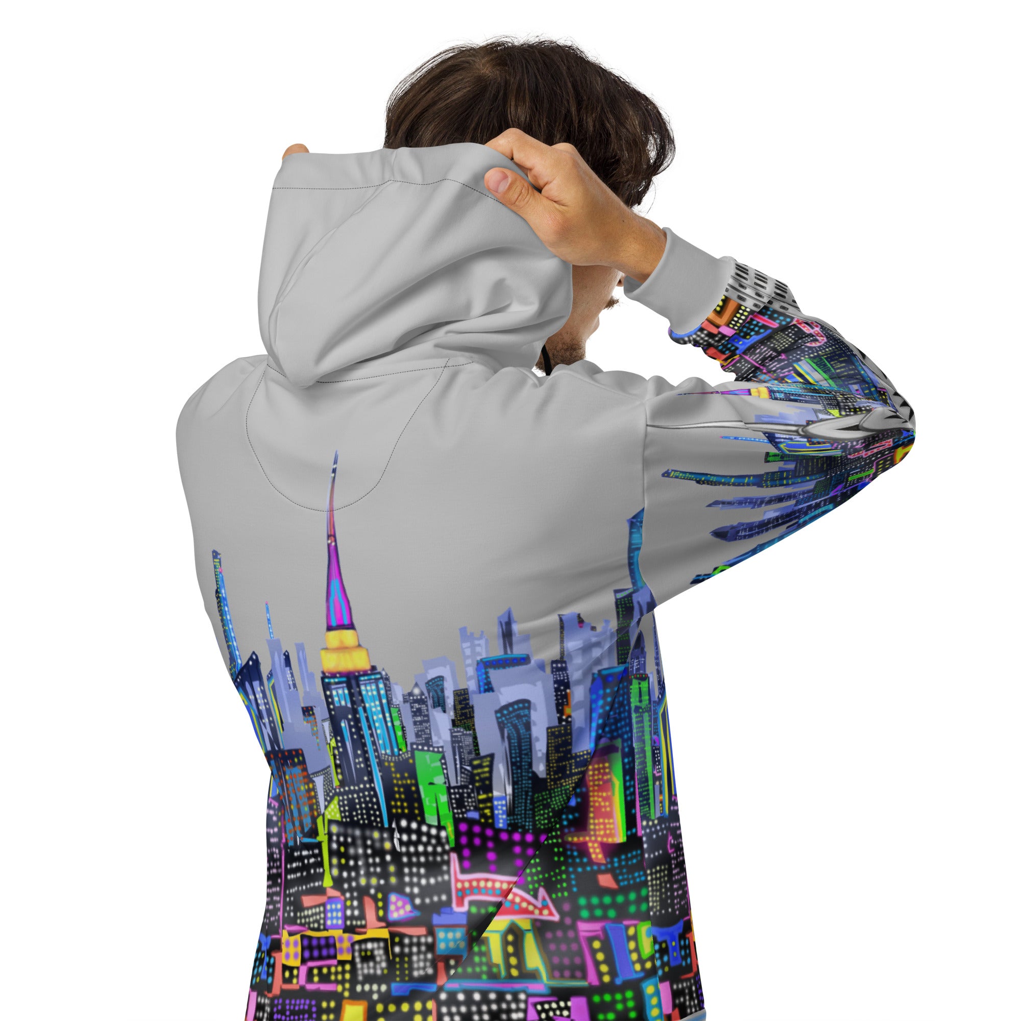 Person wearing a hoodie with a Loria NYC Art colorful cityscape design on the back